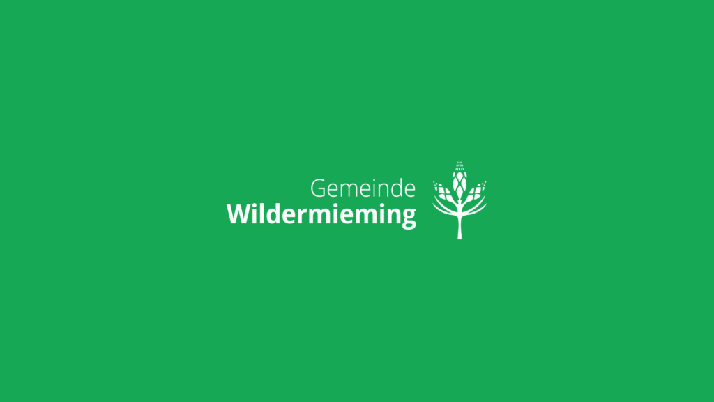 Logo Gemeinde Wildermieming auf grünem Hintergrund